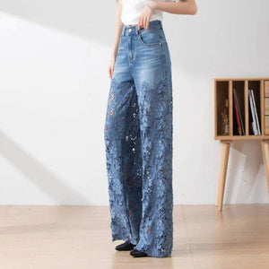 Pantaloni da donna in denim blu a vita alta con gamba larga e inserti in pizzo ritagliati