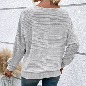 Top a righe con scollo tondo e maniche lunghe